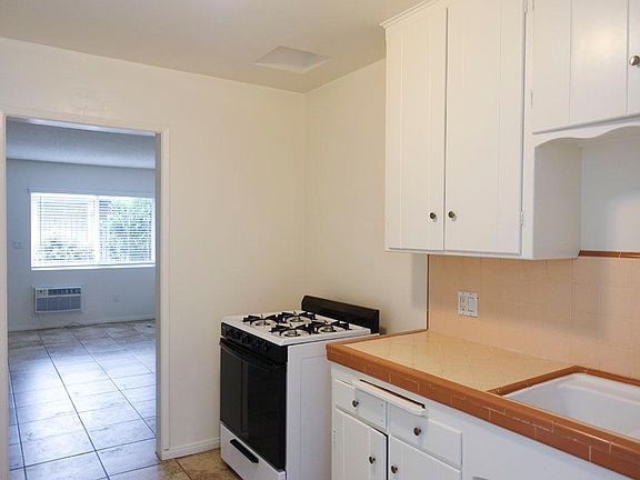 Kitchen; stock photos of a similar first floor unit.