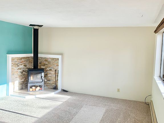 New carpet, stove, mantle 