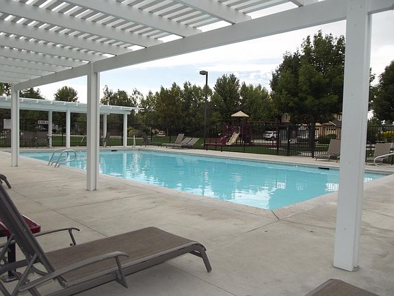 Neighborhood Pool, just across the street! Play structure in background.