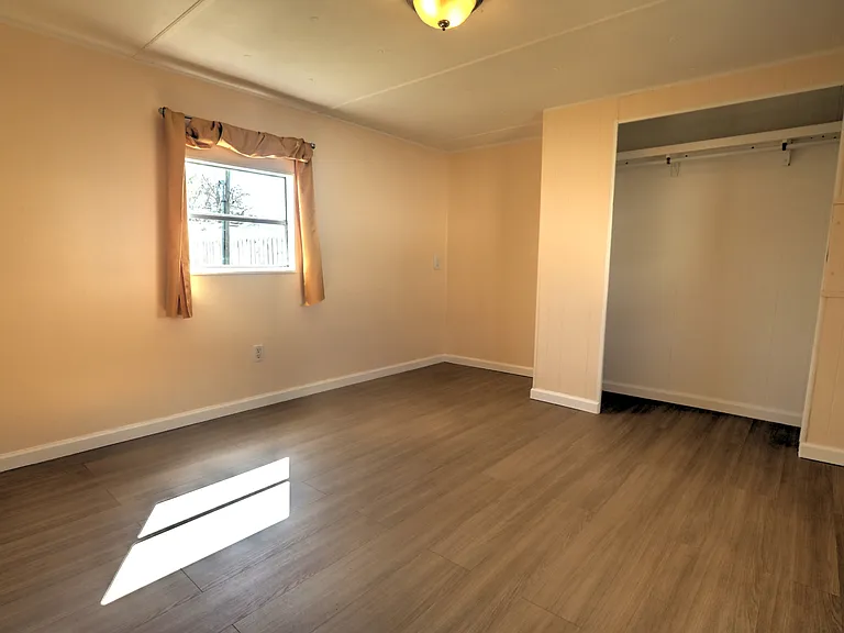 Master bedroom large enough for king-sized bed and dressers