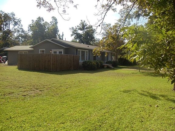 View of house from side yard - notice how large the lot is!