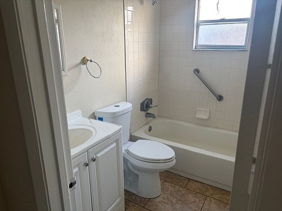 Bathroom with tub and shower combo