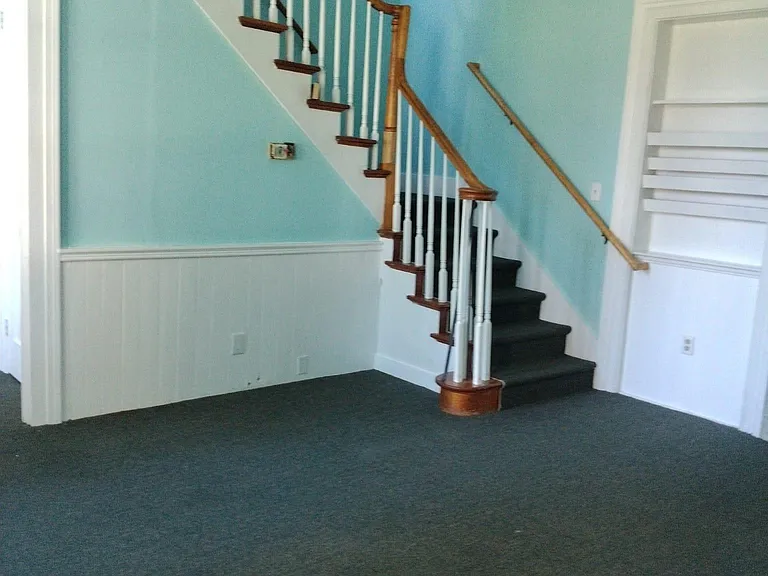 Living room is on the first floor, kitchen and bedrooms are on the second floor