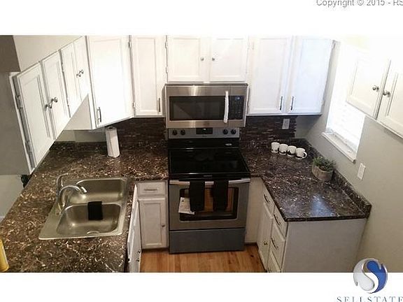 Beautiful Kitchen With Stainless Steel Appliances and Hardwood Floors
