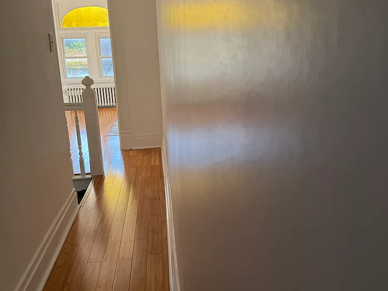 Back upstairs to 2nd Floor, featuring late afternoon light flowing out of front bedroom into hallway that leads to other bedrooms and a bathroom