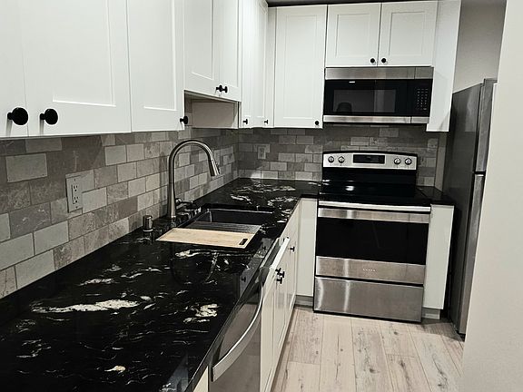 Kitchen with stainless steel appliances.