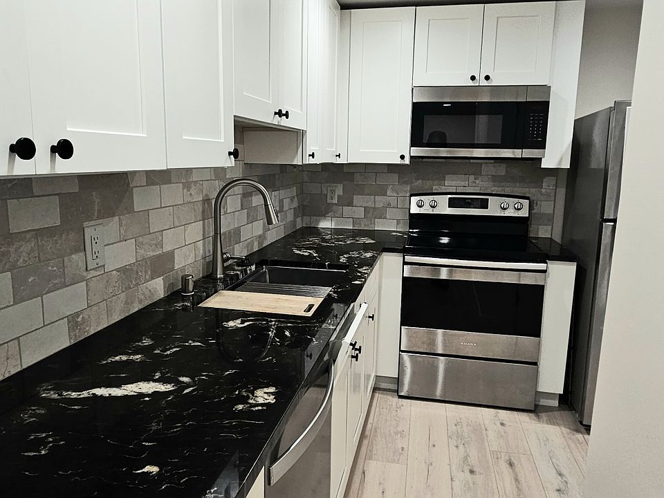 Kitchen with stainless steel appliances.