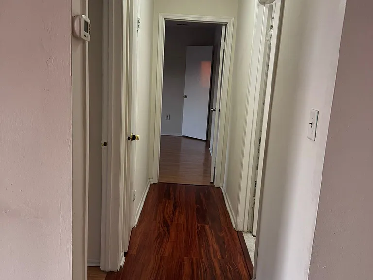 hallway to bedrooms and common bath