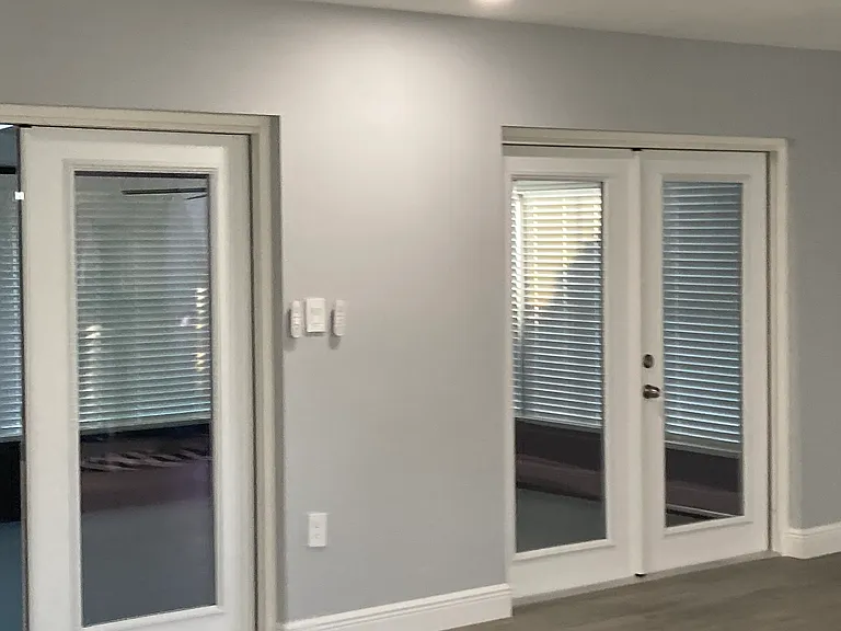 French doors towards Florida room. living room and kitchen side doors