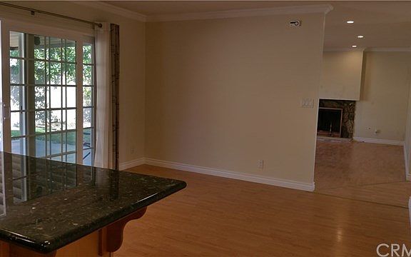 kitchen lead to bright living room.
