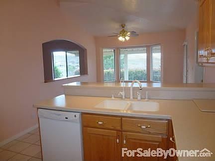 Front room
						:
						View of the front room entrance from the kitchen.