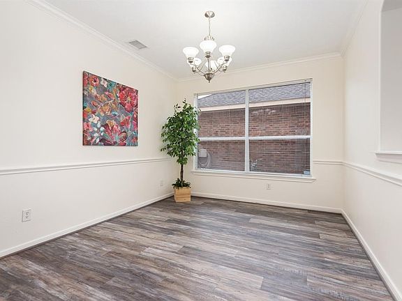 The formal dining RM is open to the family RM and offers the perfect space for those holiday family gatherings.