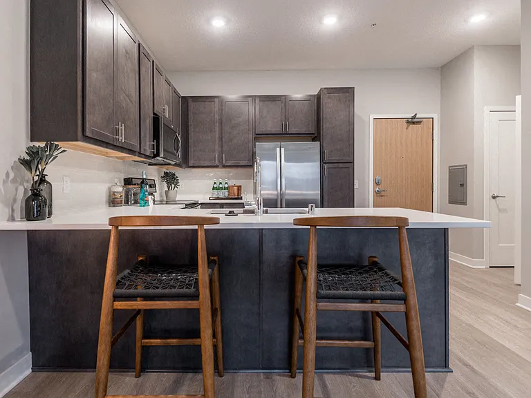 A spacious breakfast bar provides extra seating and a stylish space to gather.