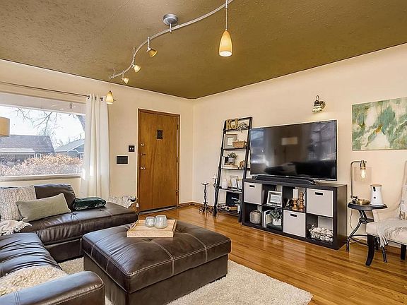 Living room at front of house. Has been repainted white.