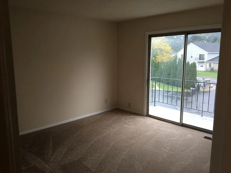 Master bedroom with balcony from door