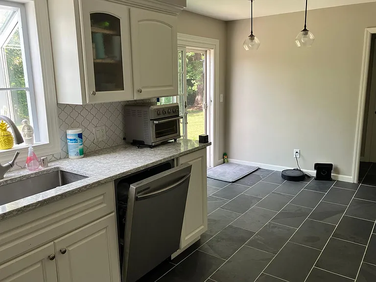 Kitchen with brand new SS appliances and lighting features