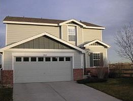 Front of house with 2 car garage