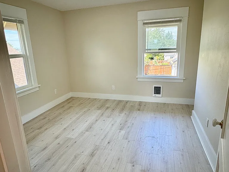 Bedroom next to laundry room and bathroom
