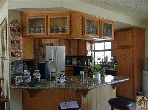 Kitchen with granite counter tops and oak cabinits.Open to great room.
