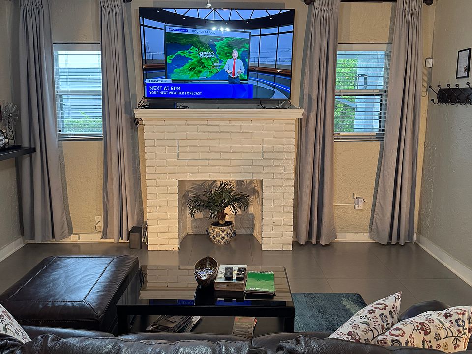 Living room: 64" smart TV with complete Comcast cable/internet package, including DVD. Couch pulls out to become a queen size bed for overnight visitors.