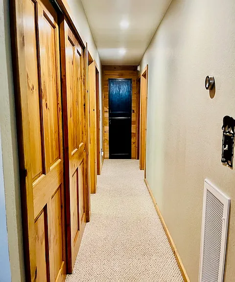 Front loading washer/dryer in hall closet, linen closet.