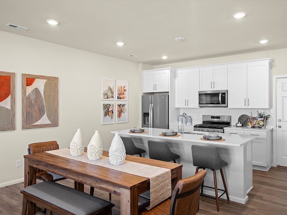 Dining and Kitchen Area - Model Home Picture (for representation of furniture layout only)