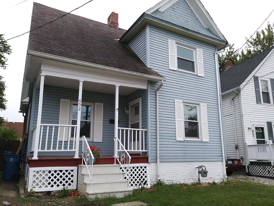 the adorable front with this beautiful porch