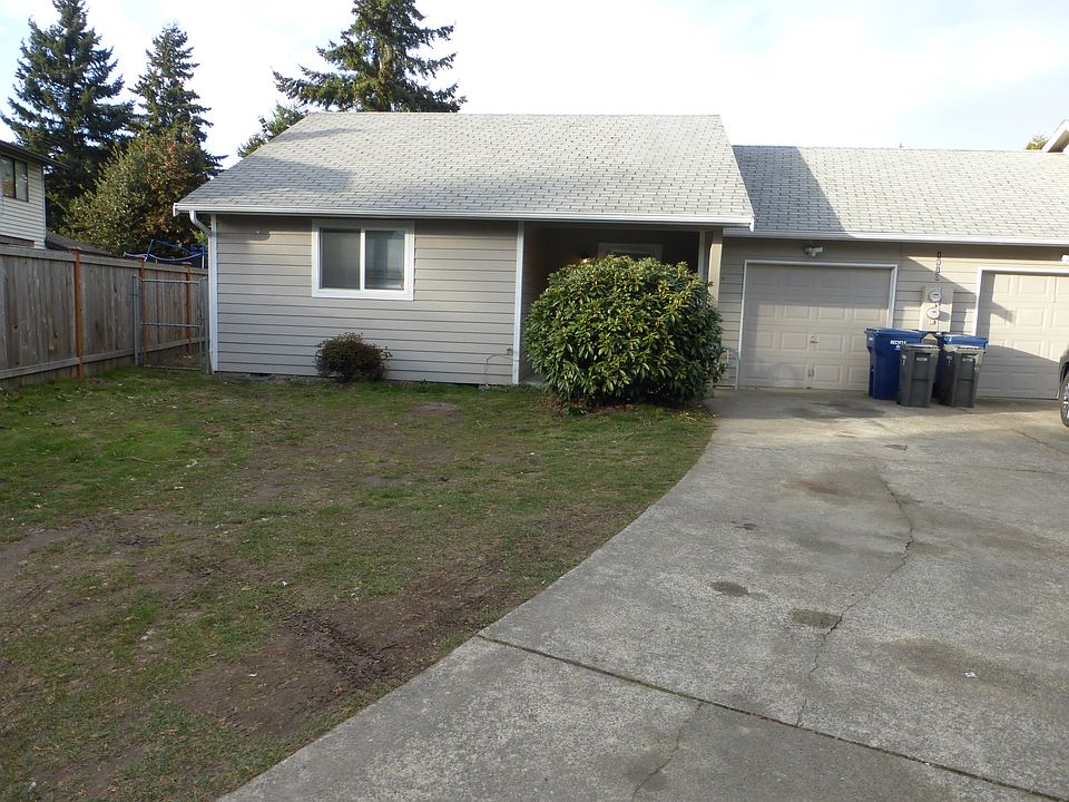 FRONT OF HOME AND SINGLE CAR ATTACHED GARAGE.