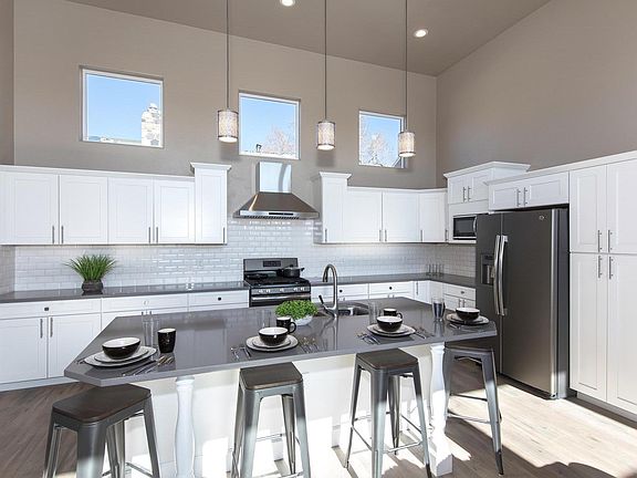 Modern and oversized Chef's kitchen with private cabinetry for each of the four Master Suites.