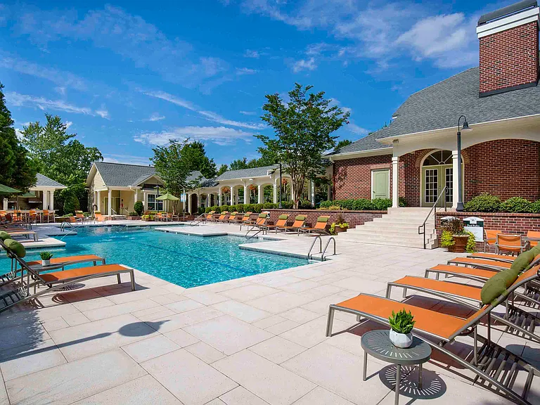 Resort-style pool and expansive sundeck with lounge seating