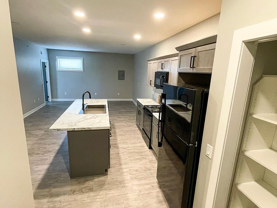 Entrance into open kitchen and living space.