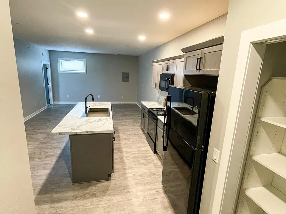 Entrance into open kitchen and living space.
