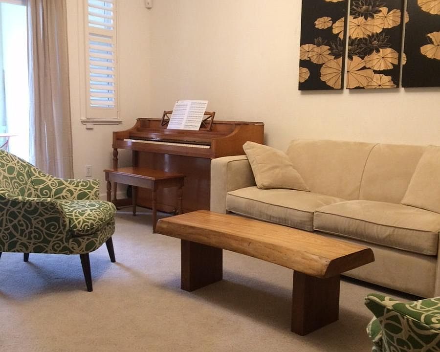 living room with piano