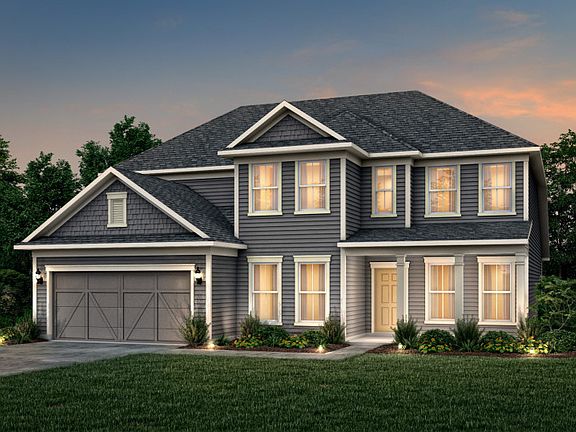 Vanderbilt Exterior 52 features Hardie Board siding, shakes, covered front porch and 2 car garage