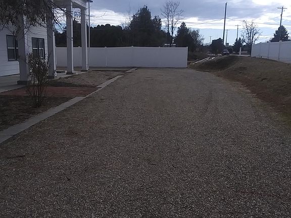 Off street main parking area with noise dampening berm and fencing