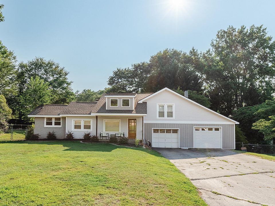Large lot with fenced in yard and two car garage (only one garage available to park a car inside).