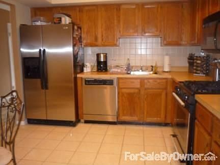 Kitchen : All newer stainless steel appliances. Refrigerator two years old