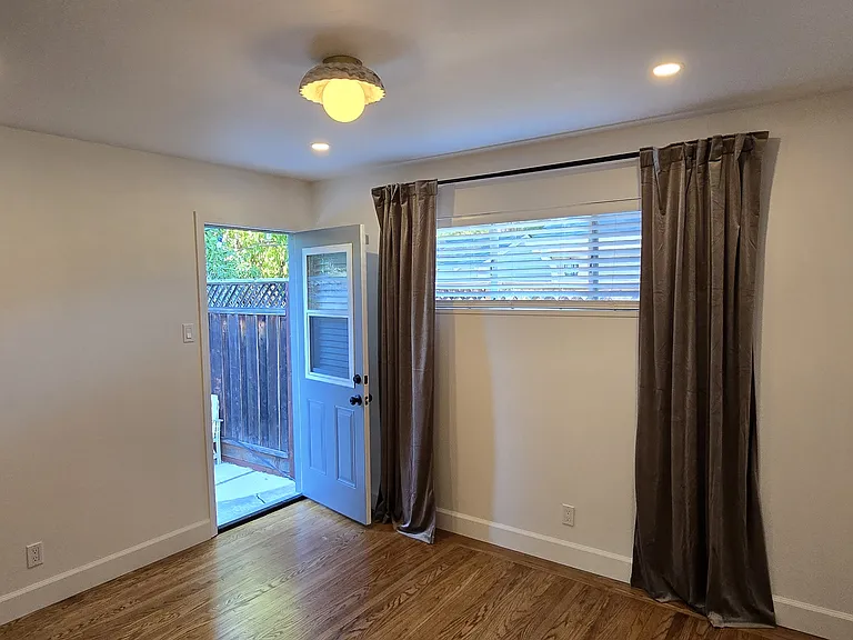 Master bedroom with door to backyard.