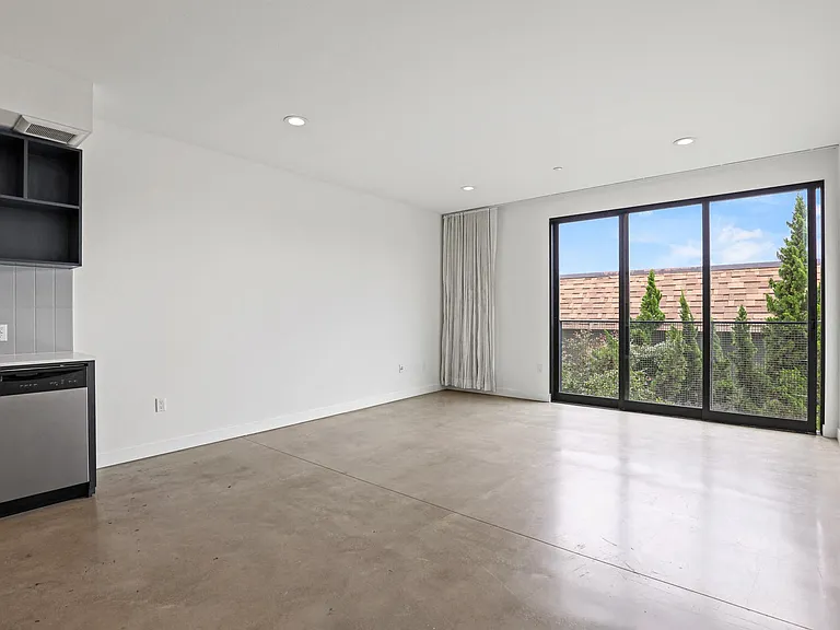 Dining and Living Room with Recessed Lighting and Concrete Flooring