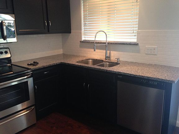 Updated kitchen with granite and stainless stee