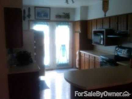 Sun through patio doors fill kitchen