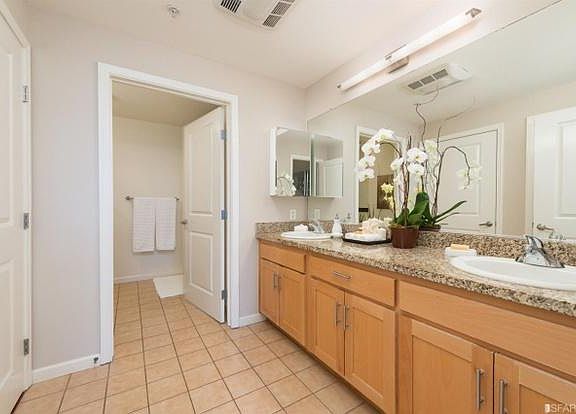 Large bathroom. Jack and Jill sinks, tub and shower. Laundry in bathroom