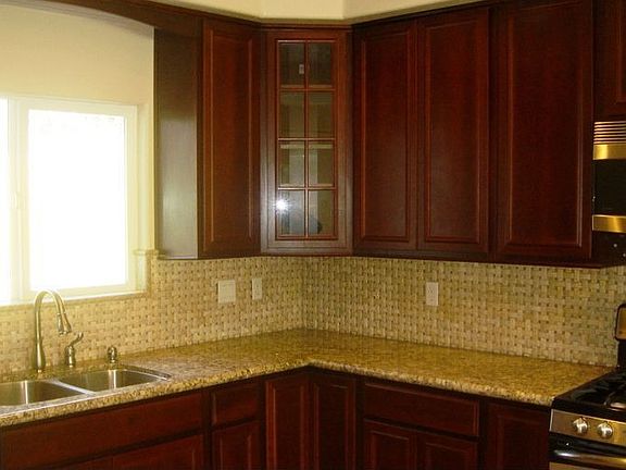Kitchen With Granite & Stainless Steel Appliances