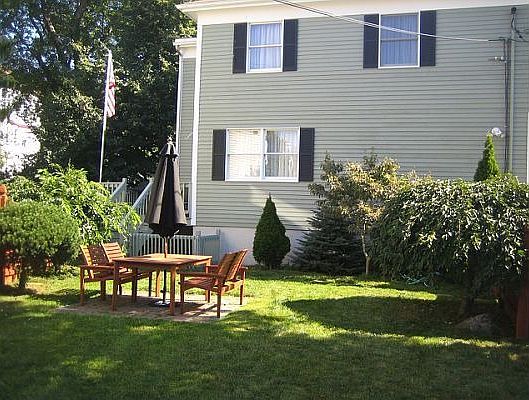 Facing the house from the private, manicured yard