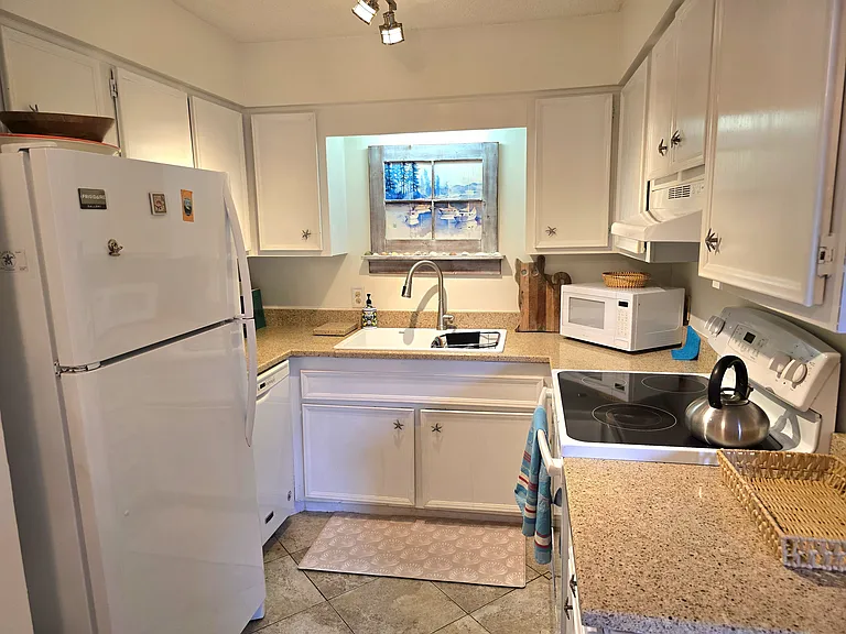 Kitchen, fully equipped including a stew pot, casserole dishes, measuring utensils, mixing bowls, etc.