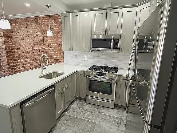 2nd image of 7012 3rd Ave #Top