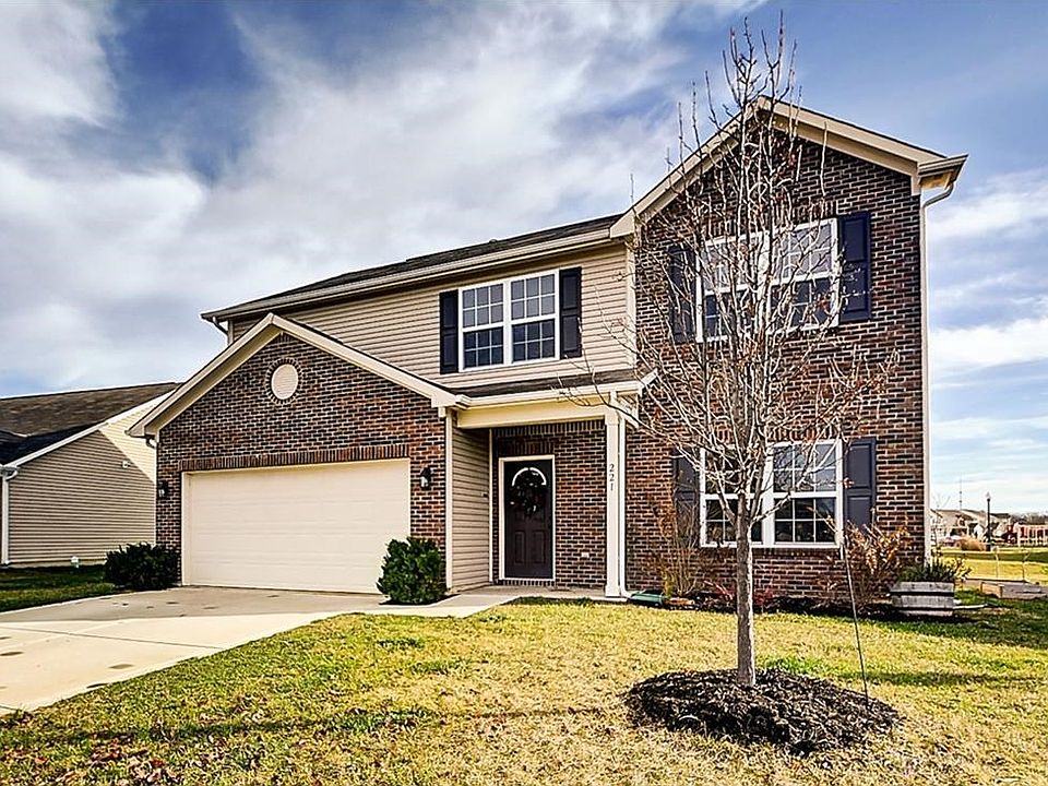 Front exterior with upgraded brick elevation