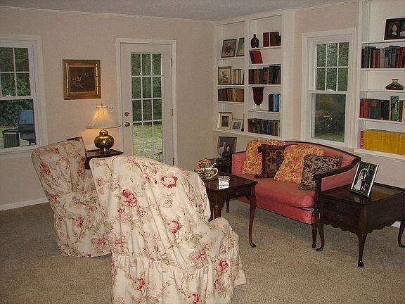The first floor den with attached office could be fourth bedroom