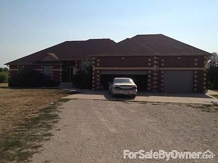 Front of House
						:
						14 foot ceilings in the garage