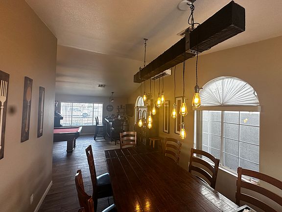 Dinning room with custom light fixture